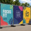 Mesh banners advertising "Focus Fit," "Live Love Local," and "Sun Fest" events.